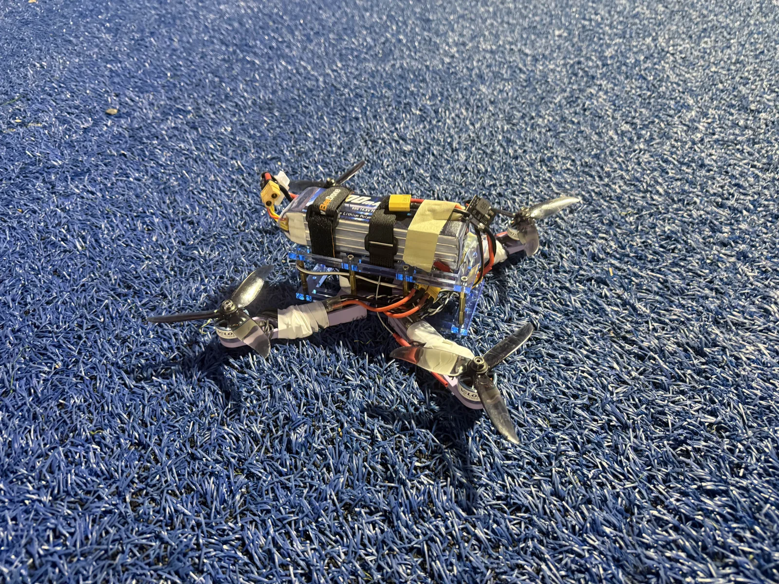 Autonomous quadcopter on a field before a test flight